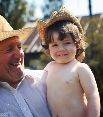 old man with child in hat