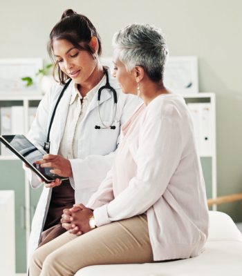 Doctor, checkup and elderly patient on tablet in office of research, online results and diagnosis advice. People, digital and healthcare report, insurance checklist and treatment schedule and medical.