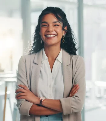 Portrait, smile and confident business woman in corporate office for ambition, finance or investment at venture capital. Happy, professional employee and worker with arms crossed for private equity.